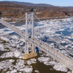 The Mid-Hudson Bridge atop sheets of ice floating on the Hudson River